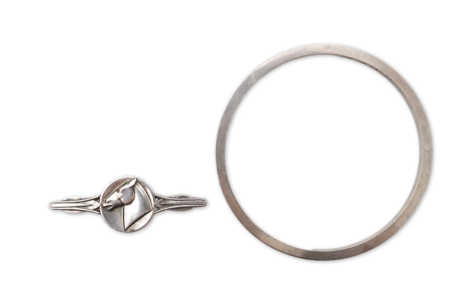 Georg Jensen, a bangle, circa 1964, and brooch, second half 20th century